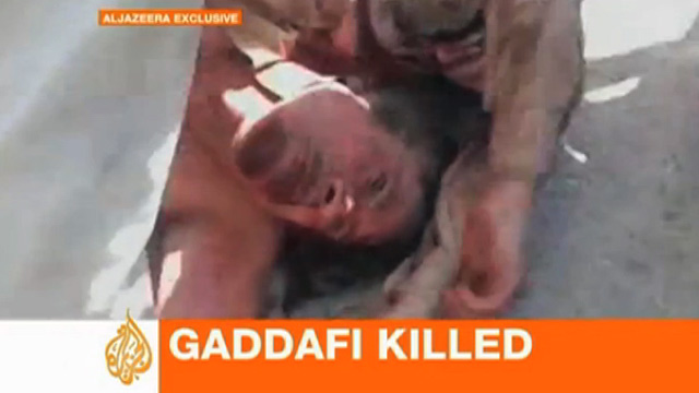 102011_gadaffi_sitll