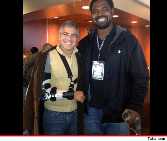 George Clooney elbow surgery and his arm in a sling